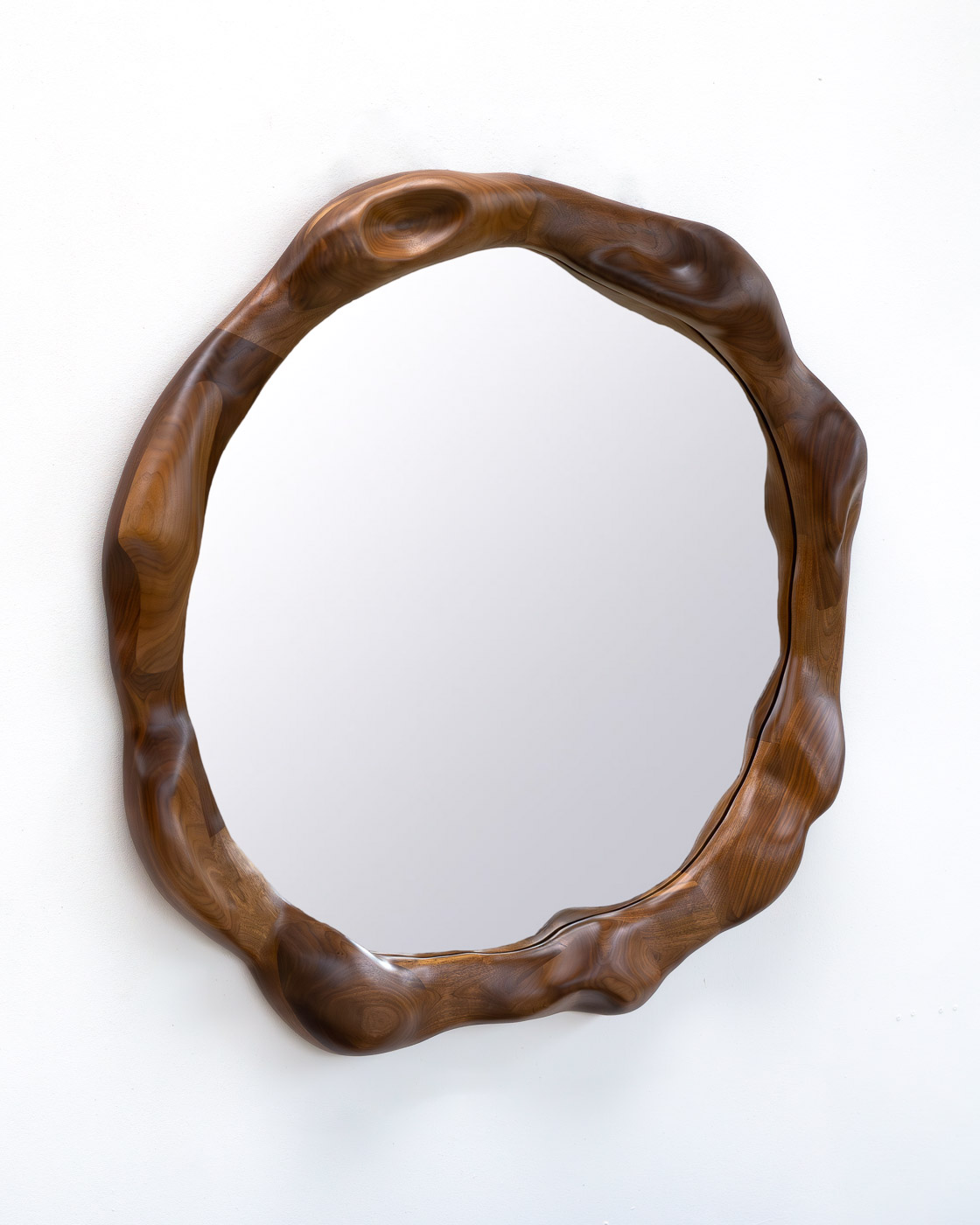 organic shaped mirror in walnut