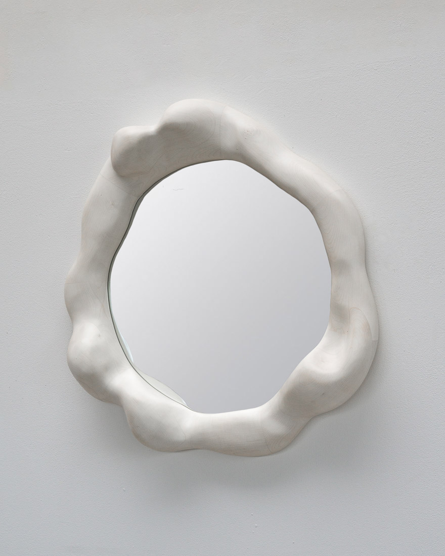 sculptural mirror in bleached maple